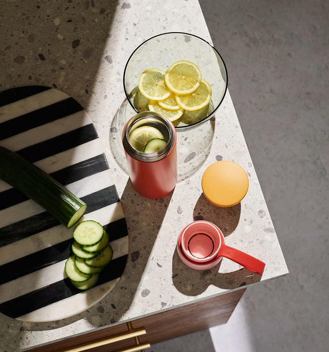 Bowl and water bottle with fruit